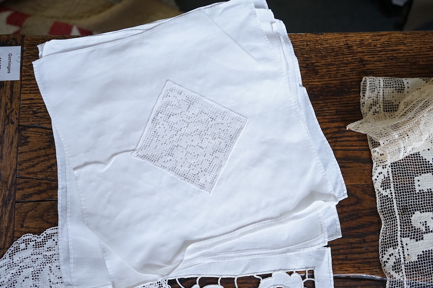 A good collection filet lace including a wide figurative elephant panel, square inserts, mats, trimming etc, with two Normandy lace mats, a cutwork mat and bobbin lace inserts.(40). Fillet panel 112cm long x 27cm wide. C